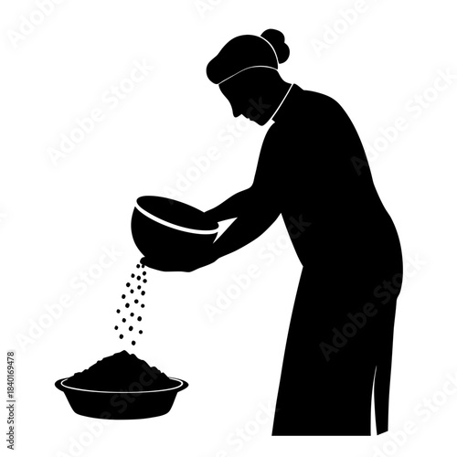 Woman pouring seeds from a bowl into a larger container in a simple kitchen setting in the afternoon