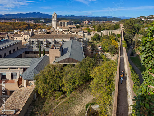 Visitors strolling along the walls, Girona city walls, Carolingian defensive sandstone construction, Cultural Heritage Site, Girona, Catalonia, Spain