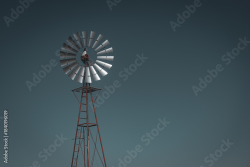 Windpump against a dark, night sky in El Paso, Texas, USA farmland