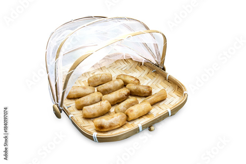 Top view of Dried bananas in Bamboo basket to prevent cattle fly, focus selectiveTop view of Dried bananas in Bamboo basket to prevent cattle fly, focus selective