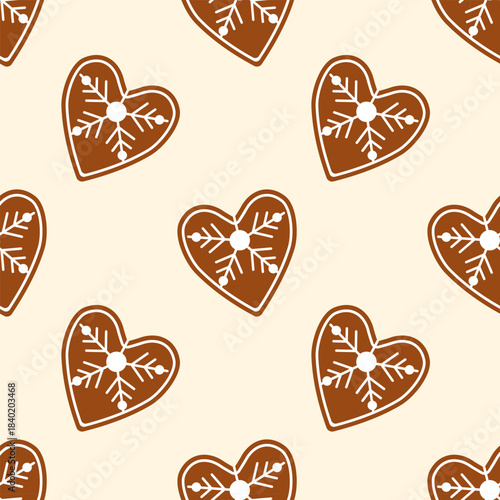 Heart shaped Christmas cookies with white icing, seamless holiday pattern featuring traditional fragrant baked goods. On warm beige background.