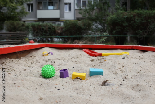 Sandbox with various outdoor toys. Sandbox for children's games. Summer concept.