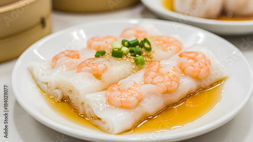 Appetizing close-up of fresh shrimp rice rolls served with a savory sauce at an Asian restaurant