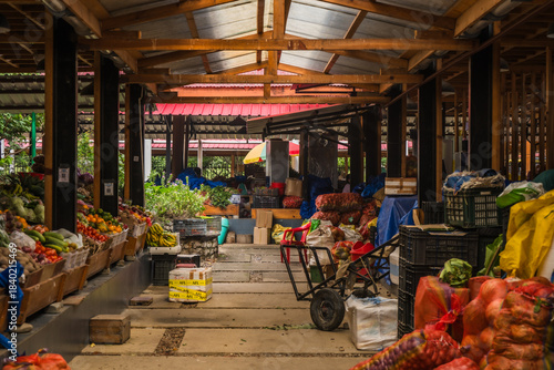 Trongsa, Bhutan - 20 September 2025: View of the vibrant Kazja Throm Market, alive with the colors of fresh produce under the sturdy wooden beams.
