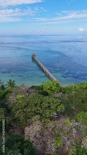 Drone shot of beautiful walking jetty in Maui Bay on the coral coast of Fiji.