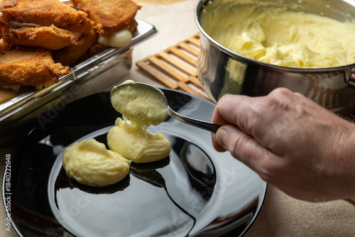 Bilde på lerret Cheese in breadcrumbs with smashed potato