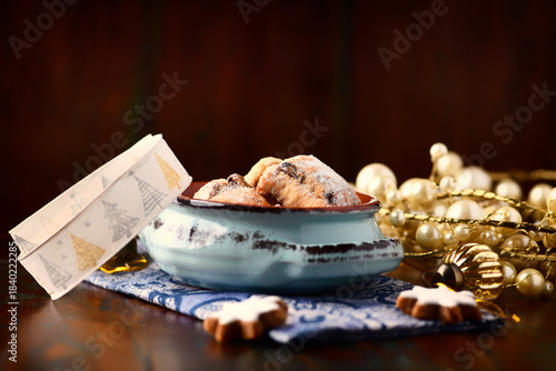 Traditional christmas cookies in a bowl on a rustic wooden background. Soft focus.