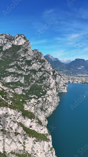 Drone shot of mountains surrounding riva del garda in italy.