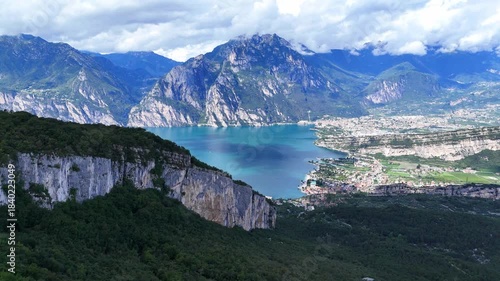 Drone shot revealing the mountains surrounding Riva Del Garda in Italy.