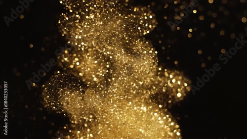 Golden Glitter Explosion - A Mesmerizing Display of Sparkling Particles.