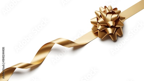 A shiny gold gift ribbon with a starshaped bow diagonally crossing a pure white background, isolated on white background