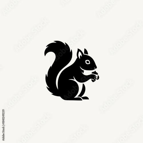 Black silhouette of a squirrel holding a nut, depicted in a minimalist and clean graphic style.