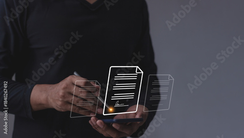 Young man with smartphone mobile hand using a pen touching to sign a Online Business Contract, Electronic signature, Contract signing, Digital documents, Future smart contract