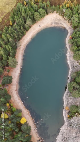 aerial view of the green loch in the cairngorms of scotland.