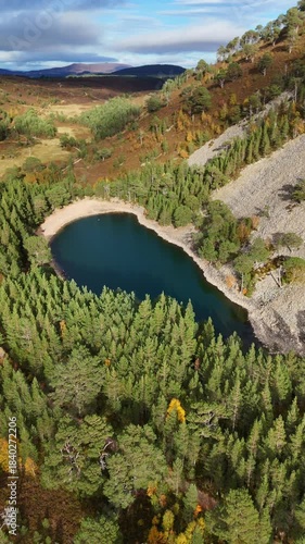 aerial view of the green loch in the cairngorms of scotland.