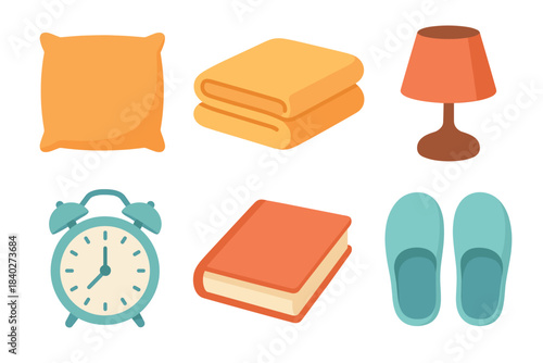 Bedroom essentials collection featuring various items like a pillow, folded towels, a lamp, and an alarm clock for comfort and rest.