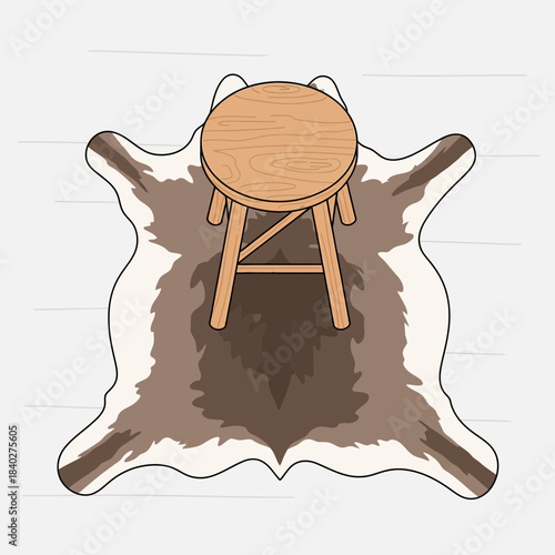 Cozy rustic wooden stool placed on a soft animal hide rug for interior decor