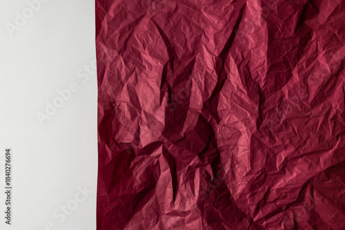 Wallpaper Mural Crumpled burgundy red paper on light gray background. A piece of wrinkled natural dark wrapping paper, sheet of paper, element for design, advertising, website, text. Abstract background Torontodigital.ca
