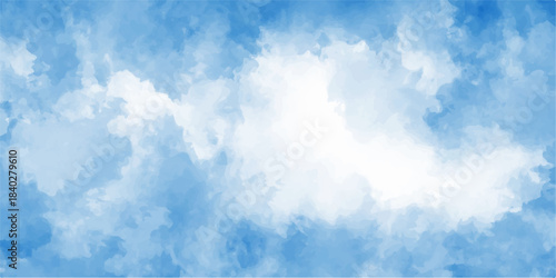 A beautiful clear blue sky with white fluffy cumulus clouds on a bright sunny summer day provides a peaceful nature background of the high atmosphere and heaven