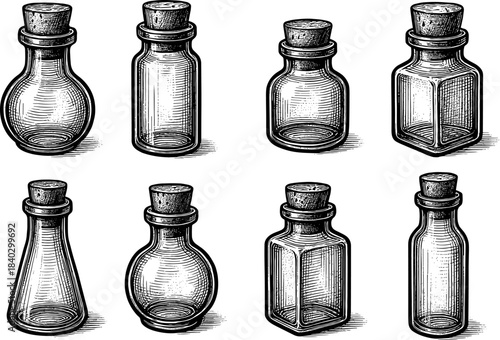 Collection of vintage glass bottles with cork stoppers in engraved style