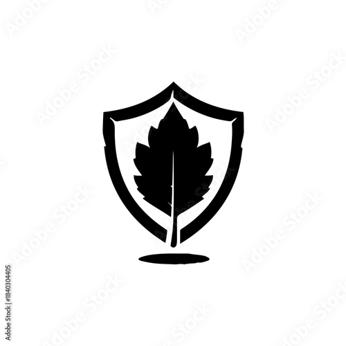 Black silhouette of a leaf inside a shield emblem, representing nature protection and security isolated on transparent background