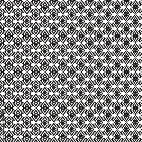 Intricate black and white geometric pattern with repeating hexagonal and diamond shapes creating a complex tessellation