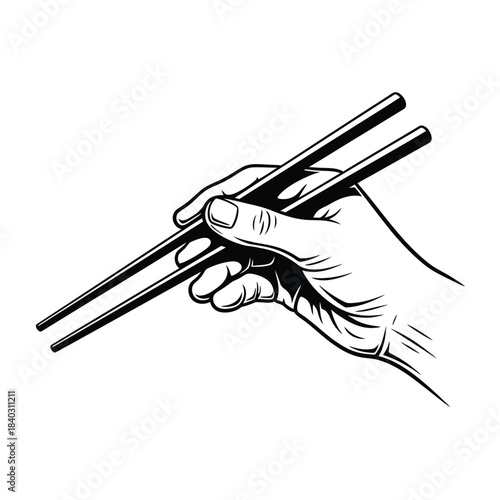Hand holding chopsticks for eating food
