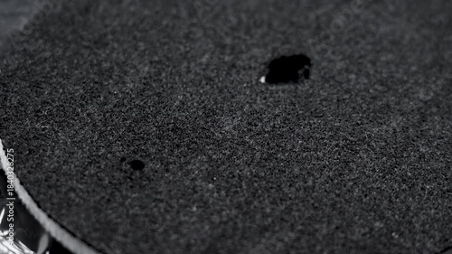 Black texture of a clean industrial filter on transparent cellophane packaging. Water purification spare part