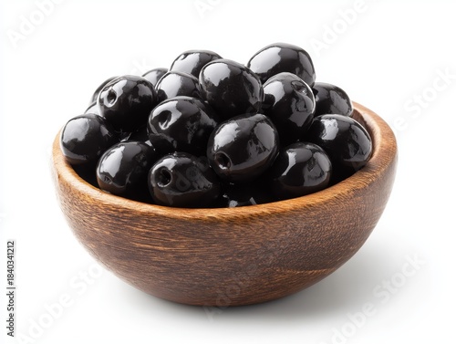 Black olives filling wooden bowl ready for appetizer