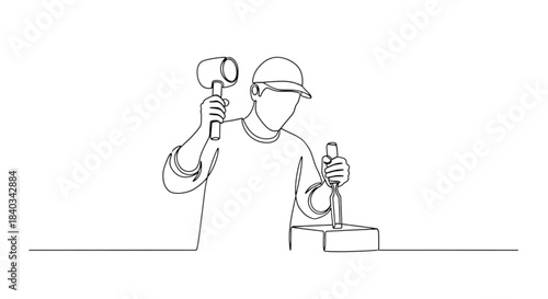 Artist holding mallet and chisel while carving stone sculpture  