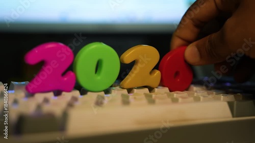Colorful plastic numbers 2026 arranged on a keyboard