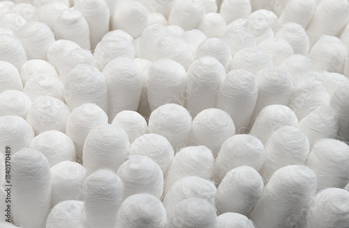 close-up view of white tips of cotton swabs, structured background