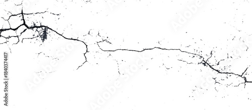 Weathered black and white grunge wall with scratched background. damaged aged stone surface featuring abstract cracked pattern.