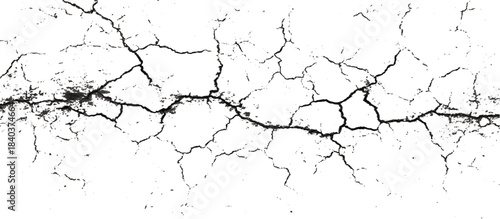 Weathered black and white grunge wall with scratched background. damaged aged stone surface featuring abstract cracked pattern.