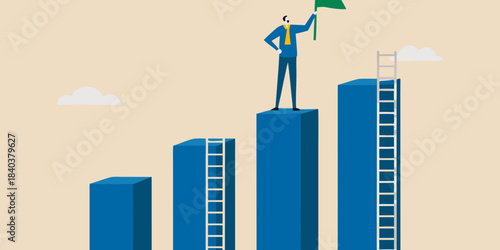A businessman stands on a bar graph celebrating success with a green flag
