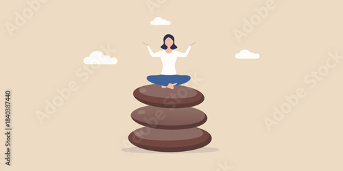 Woman meditating in lotus position atop balanced stones finding inner peace