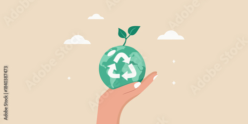 A hand holding an earth globe covered with recycling symbols and a sprout