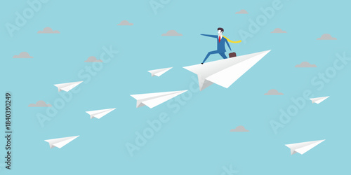 A businessman flies on a paper airplane amidst a trail of similar planes