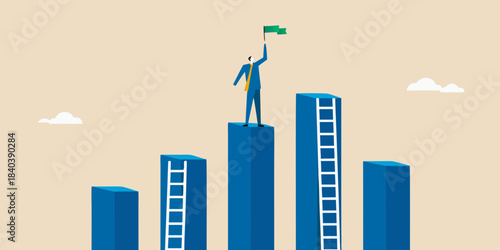 A business person celebrating success on top of a bar graph structure