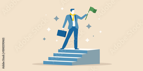 A businessman celebrates success reaching the top with a green flag in hand