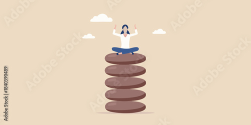 A person meditating in a peaceful pose atop a tall stack of stones