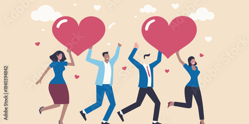 People joyfully holding and lifting large red hearts in a celebratory scene