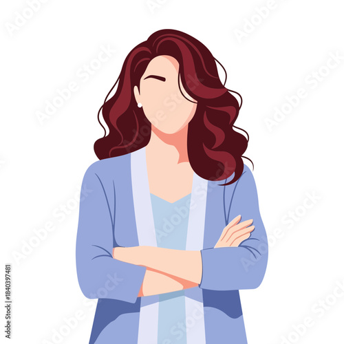 Portrait of a confident woman with long, wavy dark red hair wearing a light blue cardigan, arms crossed