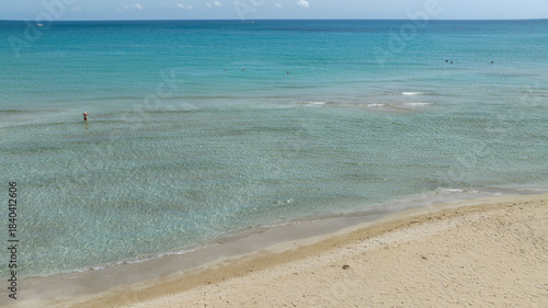 Photos Aerial view of a white beach overlooking a clean, crystal-clear sea