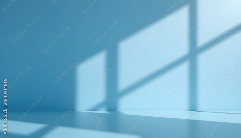 Fototapeta premium Minimalist Blue Wall with Soft Shadow Patterns from Window Light