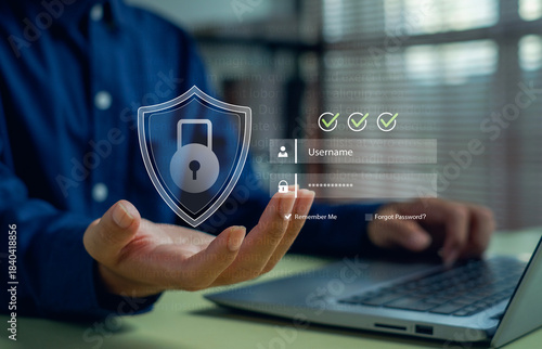 Photography person accessing a secure login interface with a digital shield icon, representing cybersecurity, data protection, authentication, password security, online privacy, and safe digital access