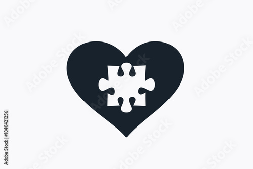 Neurodiversity acceptance concept, black heart with white puzzle piece, symbol of autism awareness, love, and understanding