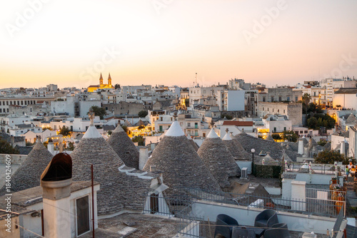 A panoramic view of Italy’s trulli rooftops from above, highlighting unique stone architecture, Mediterranean charm, and the atmosphere of travel, tourism, cultural heritage, and slow local life.