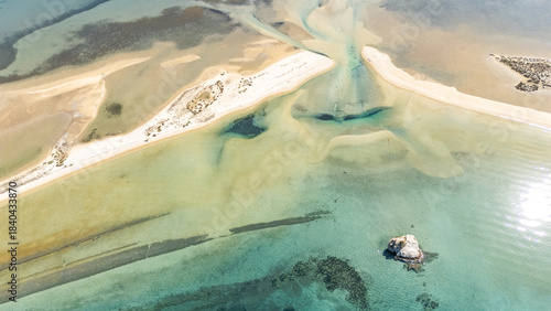 Aerial drone view of Fteroti Beach, sandbanks and lagoon in Sithonia, Chalkidiki, Greece