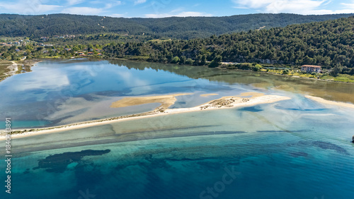Aerial drone view of Fteroti Beach, sandbanks and lagoon in Sithonia, Chalkidiki, Greece